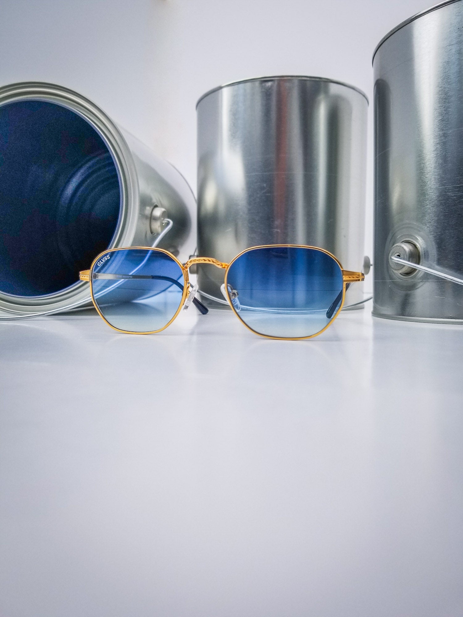 Glvss ; the flash , gold blue lens
